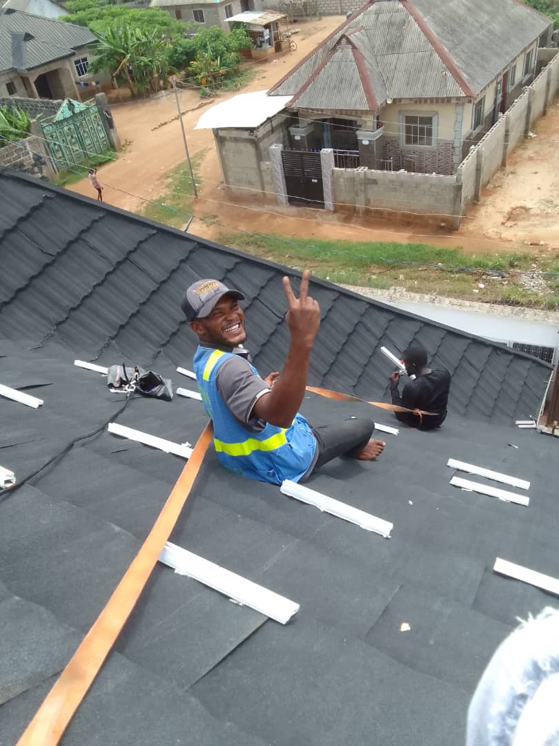 Wanaga team installing solar on a rooftop